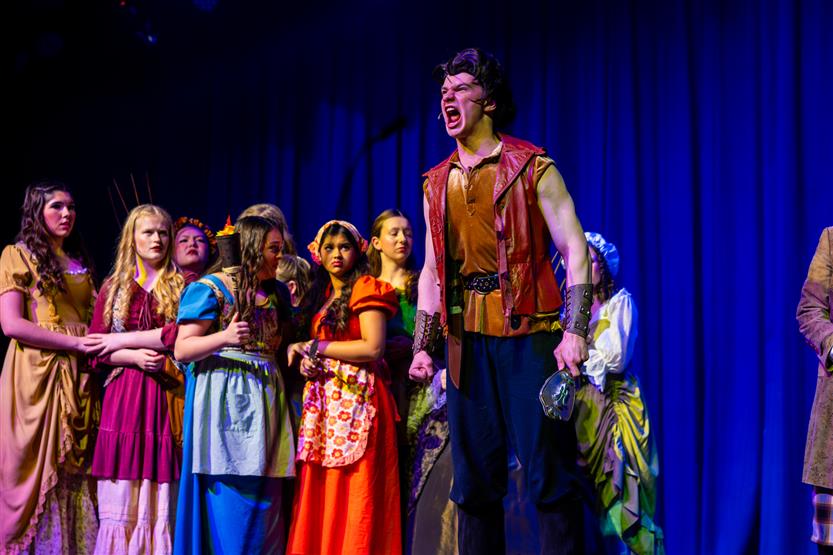 Actors perform onstage